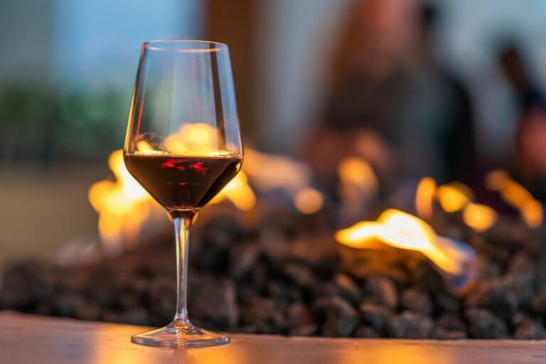 Glass of Red Wine and Fire Pit